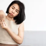 Asian woman having problem black elbows.